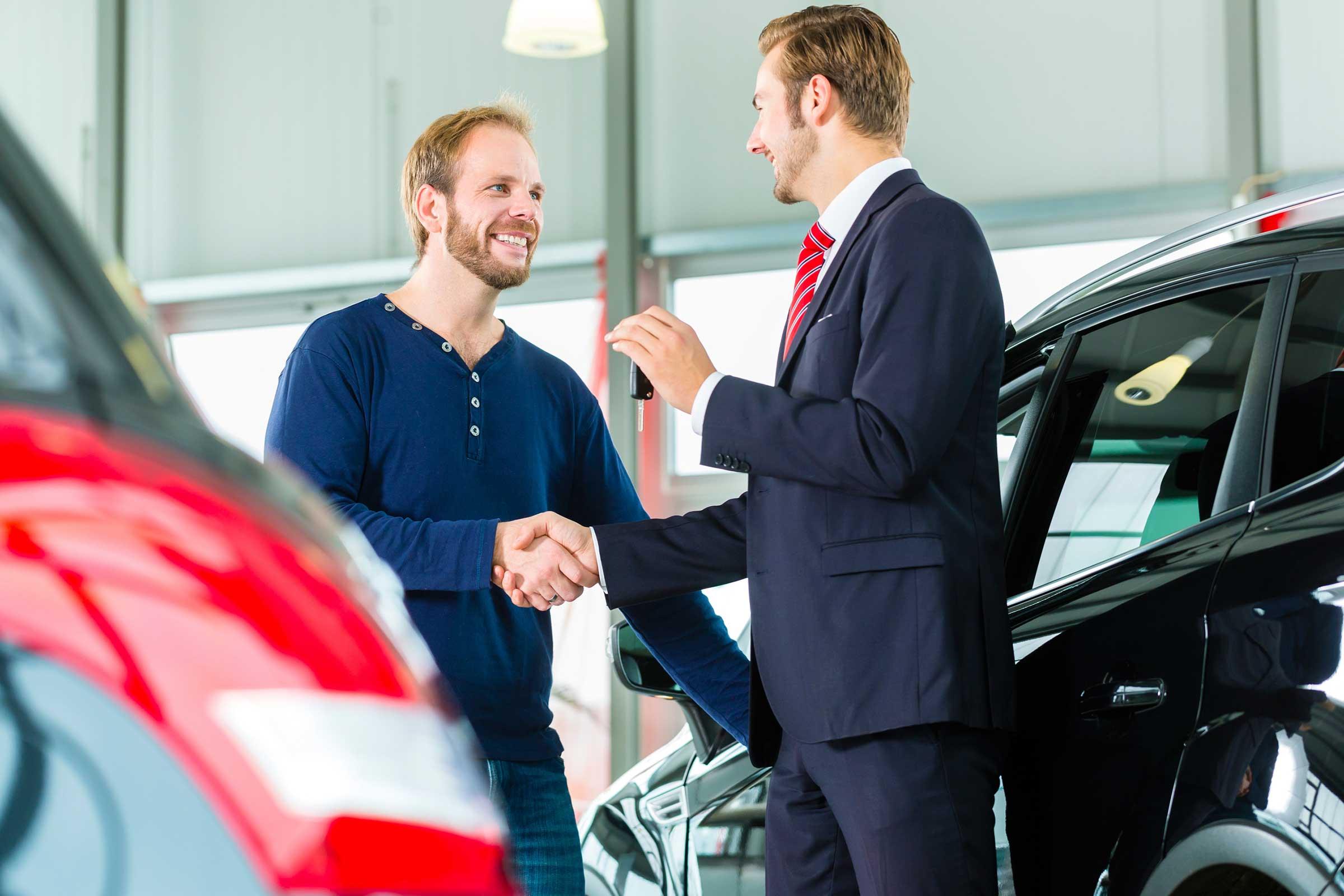 car salesman closing deal